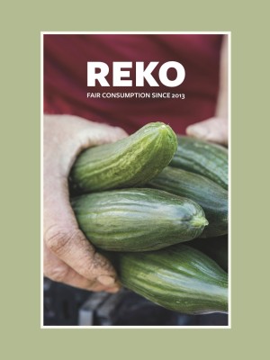 The frontpage of the book, the english version. A hand and cucumbers.